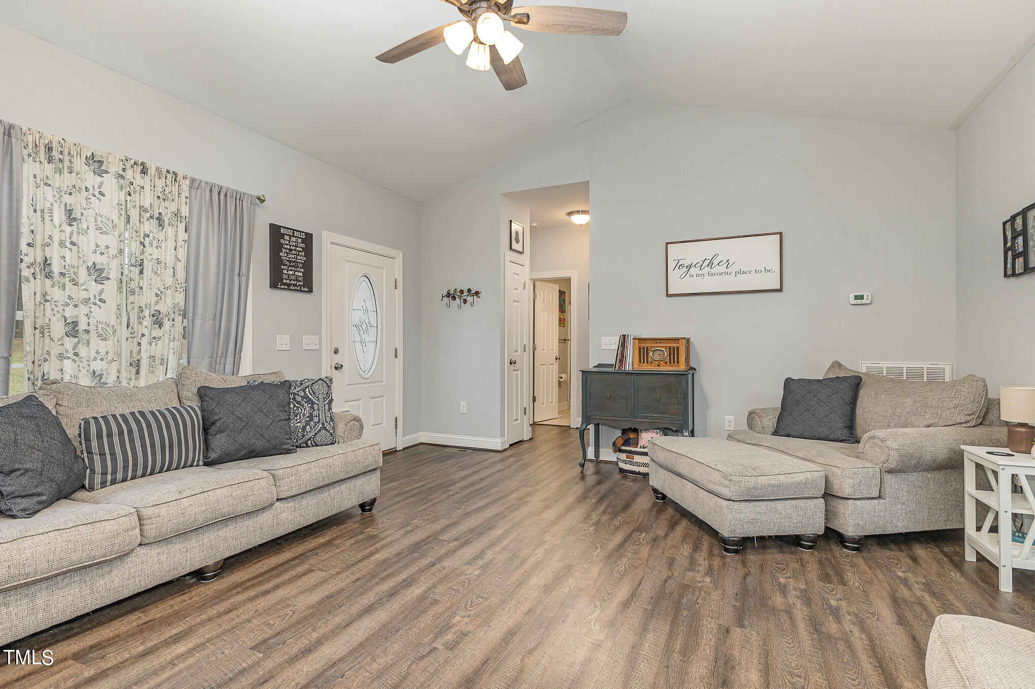 107 Piney Forest Road Roxboro, NC 27574 - Photo 6 of 27 a living room with furniture and a wooden floor