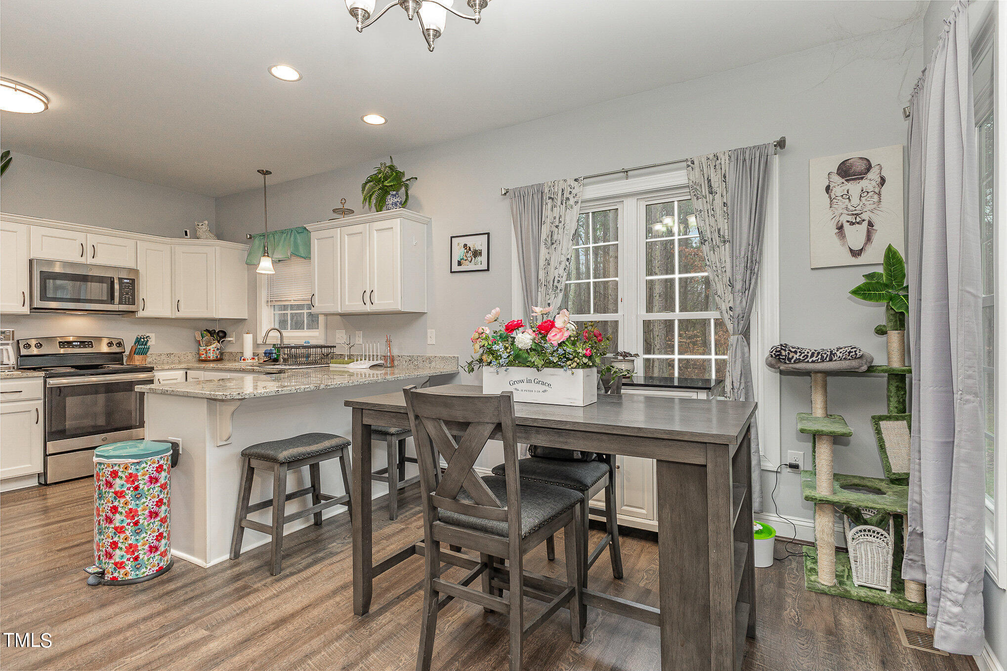 107 Piney Forest Road Roxboro, NC 27574 - Photo 8 of 27 a kitchen with granite countertop kitchen island stainless steel appliances a dining table and chairs