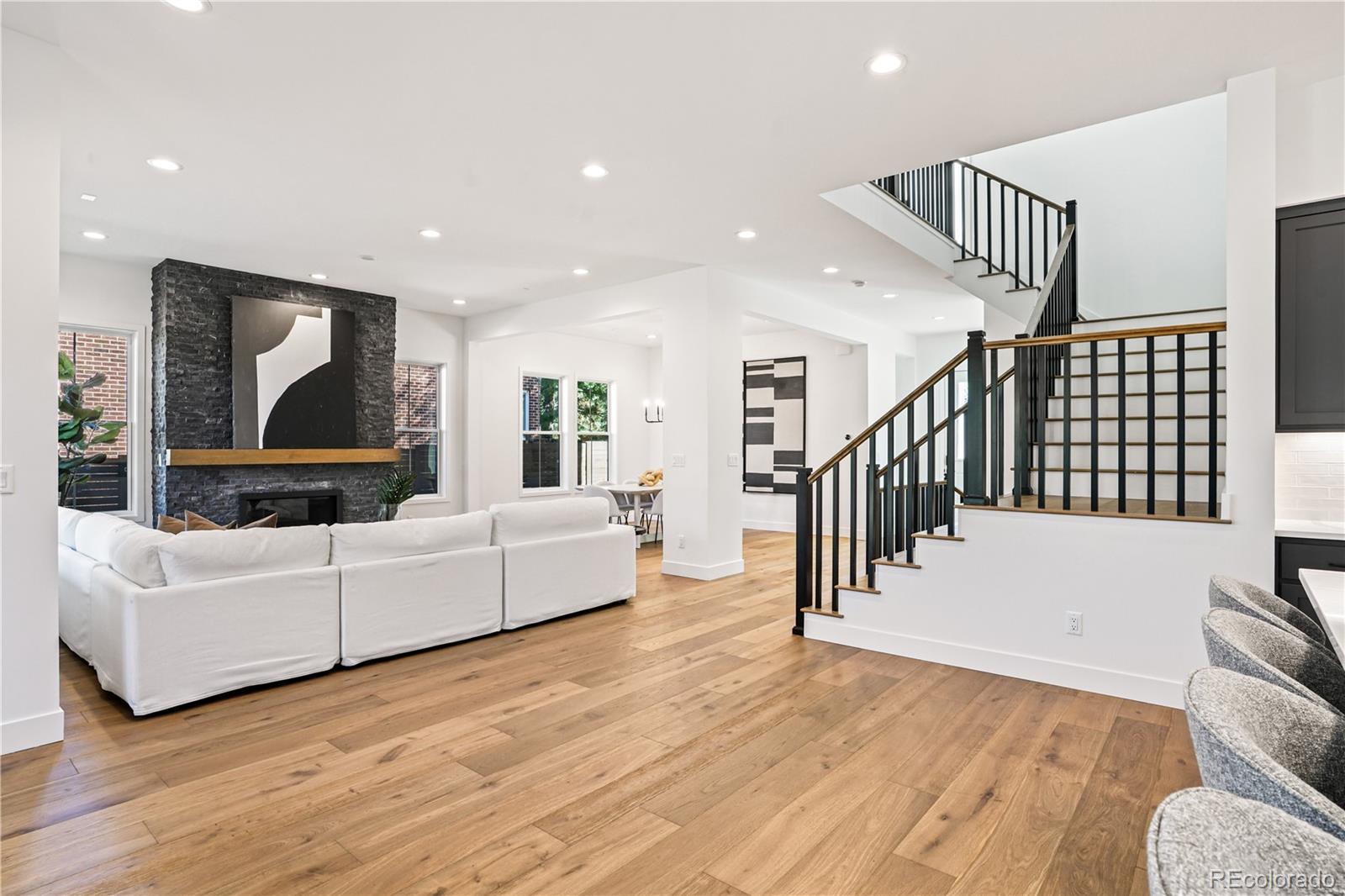 1067 South Cook Street Denver, CO 80209 - Photo 16 of 35 a living room with furniture and a flat screen tv