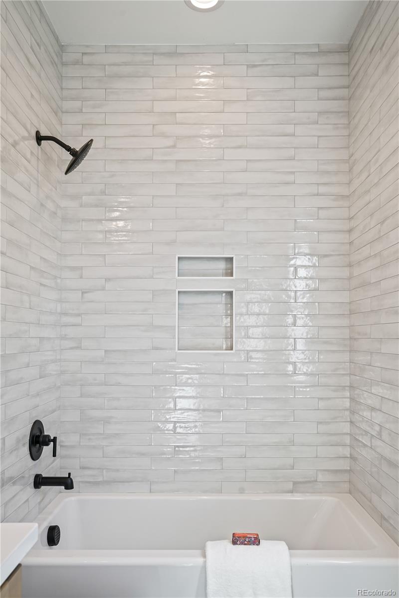 1067 South Cook Street Denver, CO 80209 - Photo 20 of 35 a bathroom with a bathtub