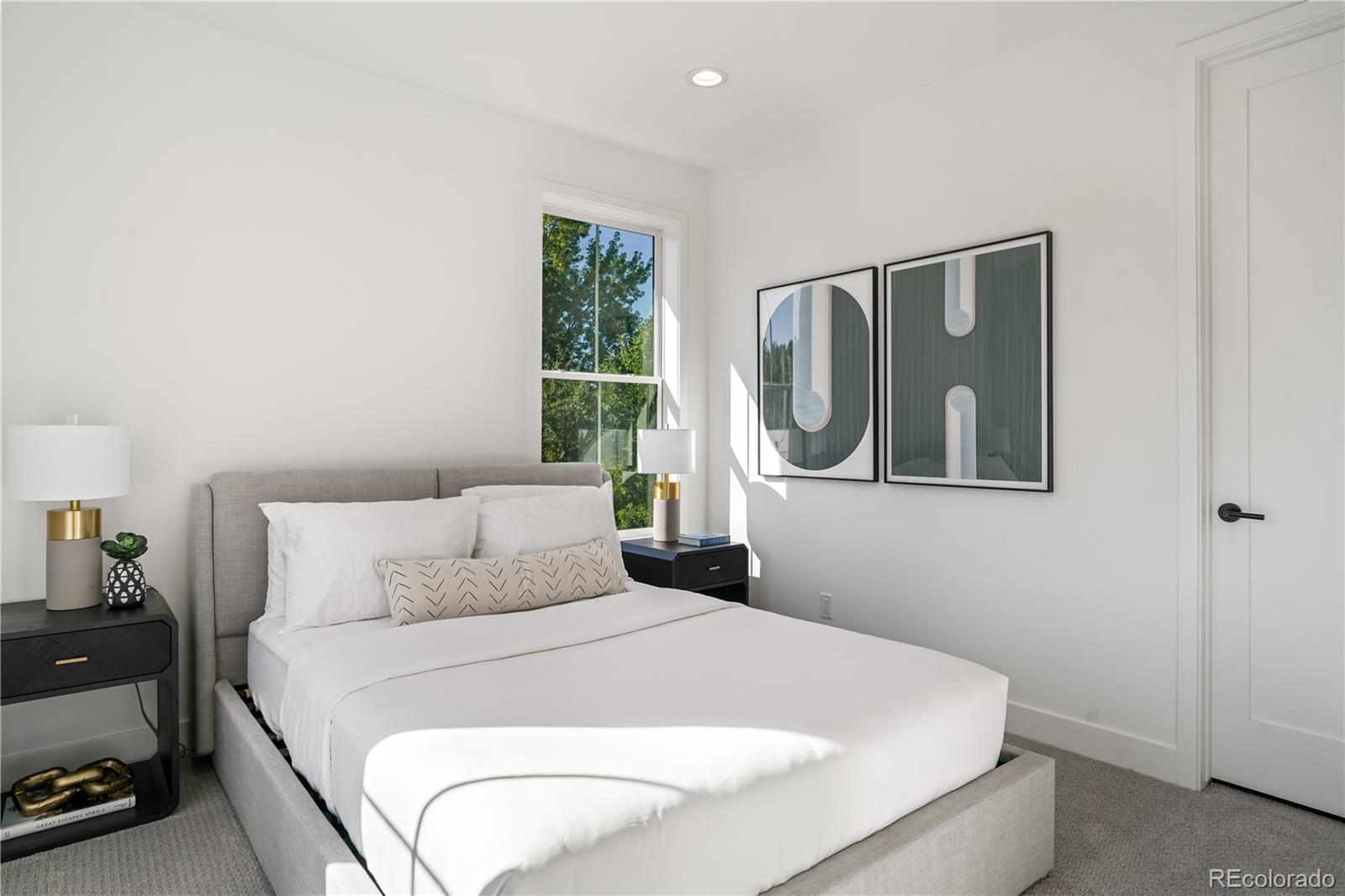 1067 South Cook Street Denver, CO 80209 - Photo 21 of 35 a bedroom with a bed and a window