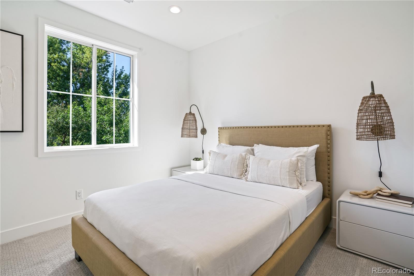 1067 South Cook Street Denver, CO 80209 - Photo 23 of 35 a bedroom with a bed and a window