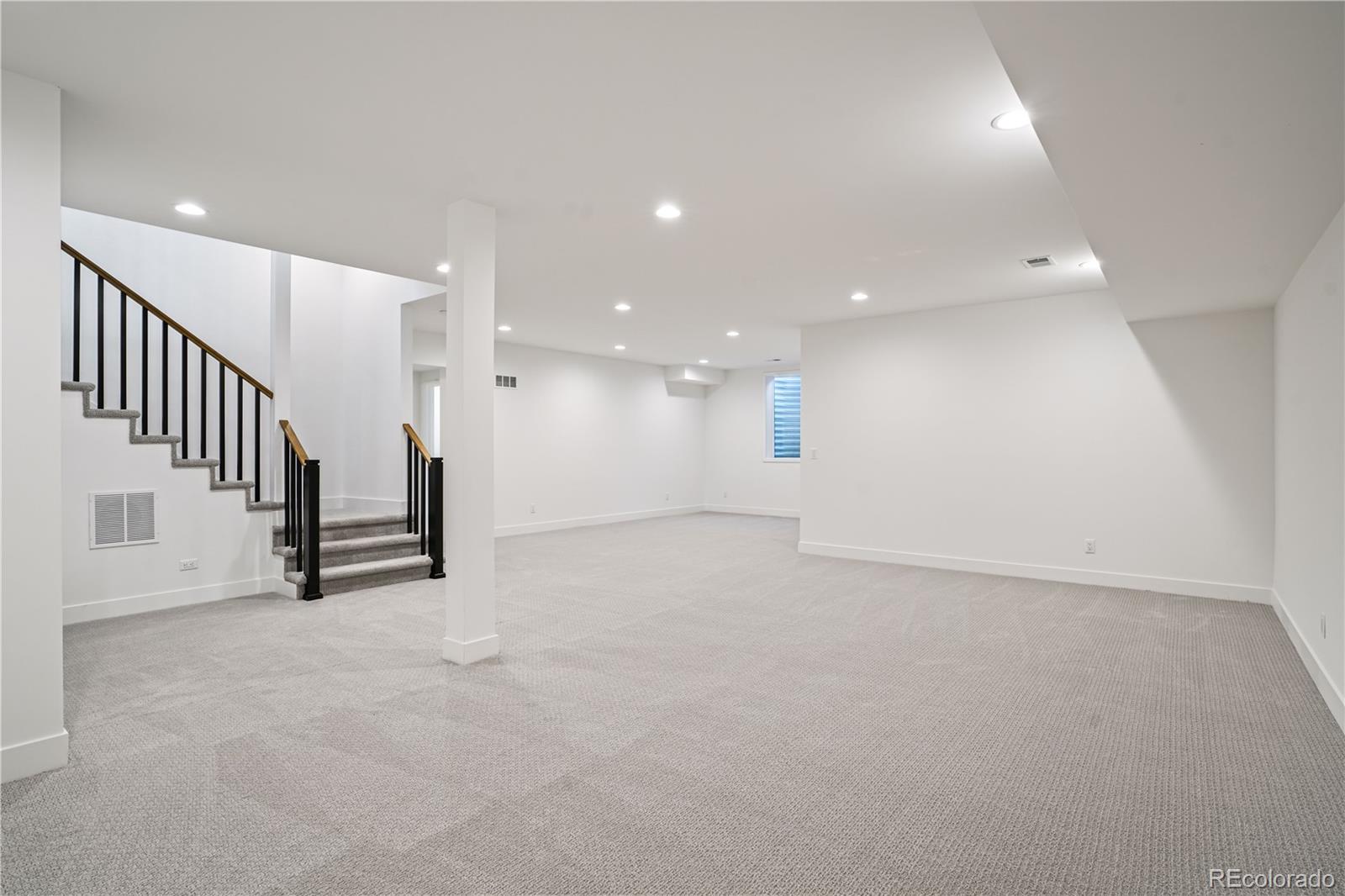1067 South Cook Street Denver, CO 80209 - Photo 28 of 35 a view of an empty room with stairs