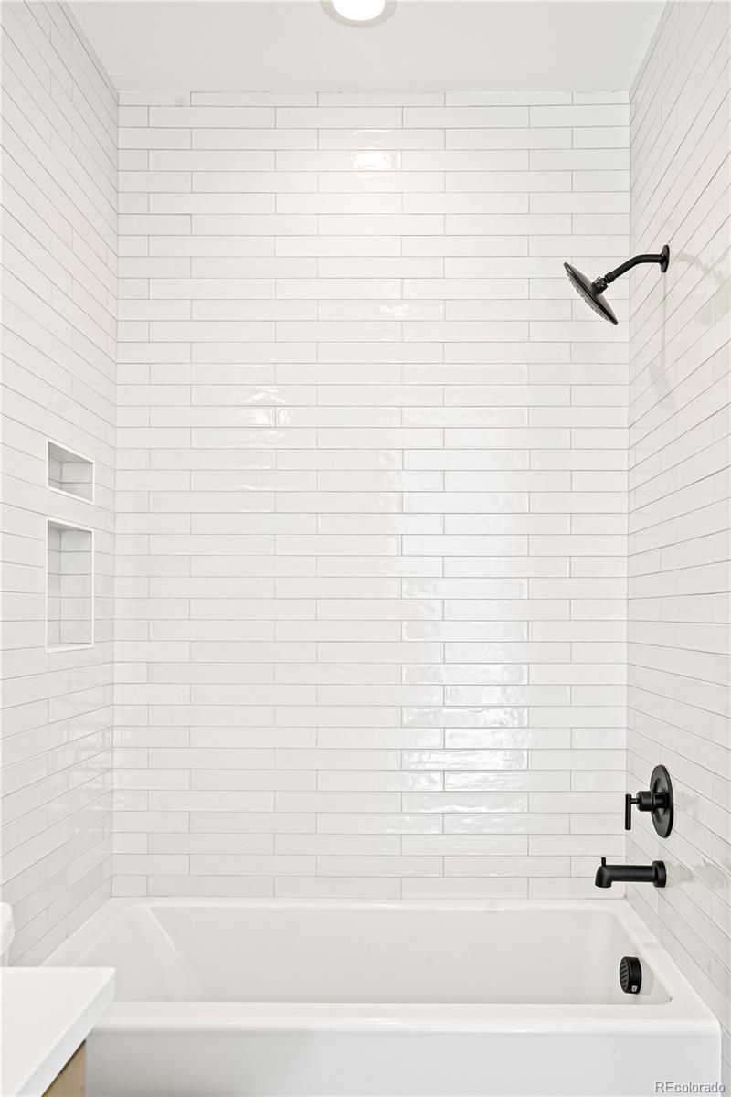 1067 South Cook Street Denver, CO 80209 - Photo 30 of 35 a bathroom with a bathtub