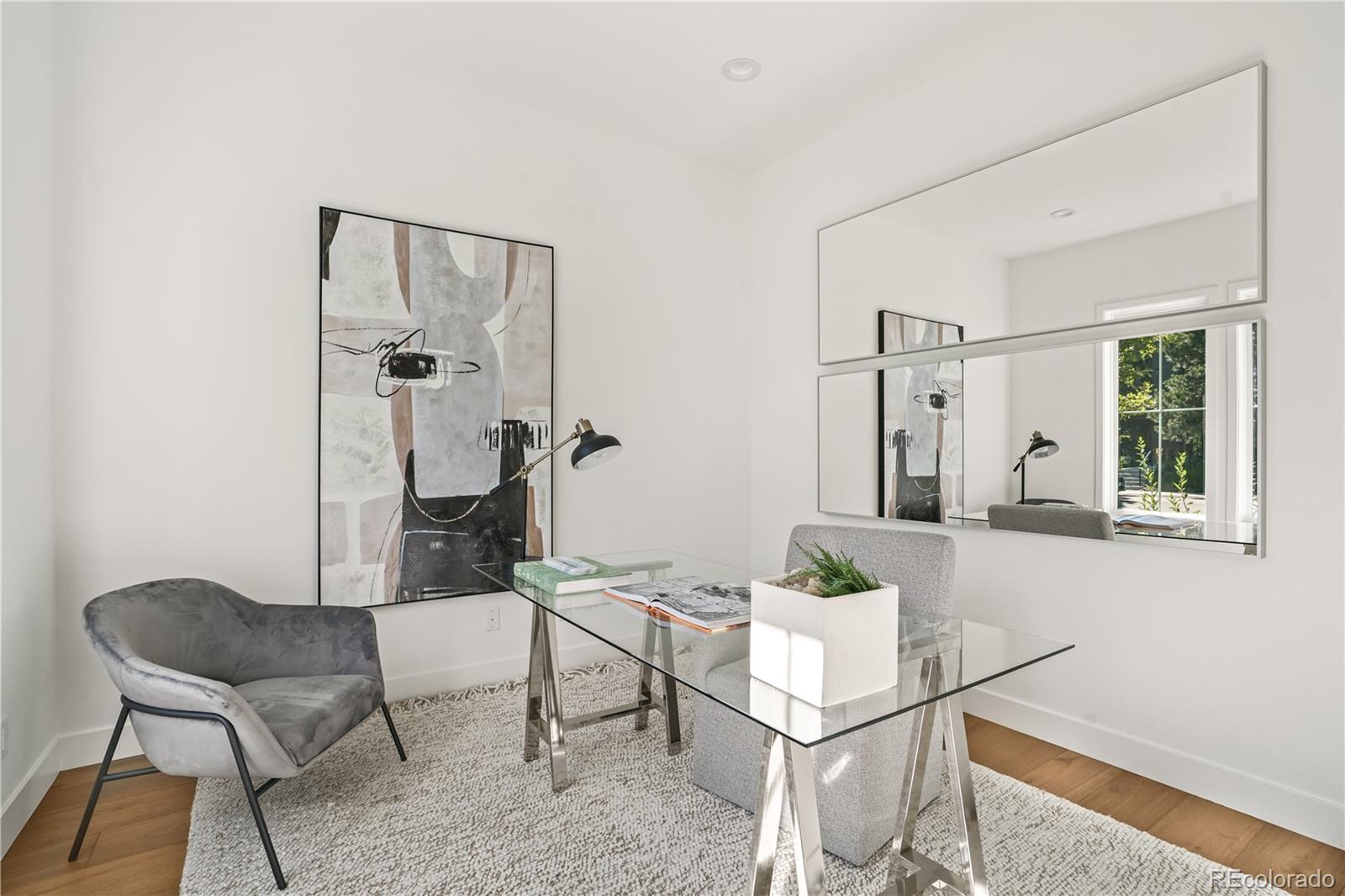1067 South Cook Street Denver, CO 80209 - Photo 6 of 35 a living room with furniture and a window