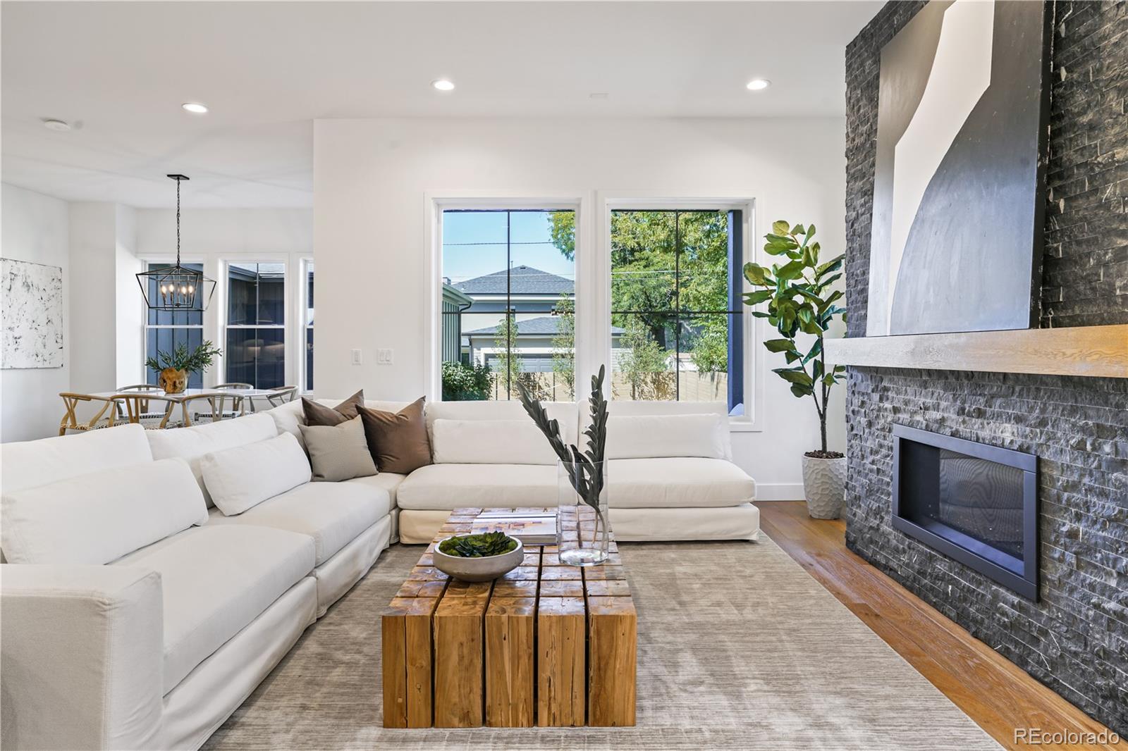 1067 South Cook Street Denver, CO 80209 - Photo 8 of 35 a living room with furniture and a fireplace