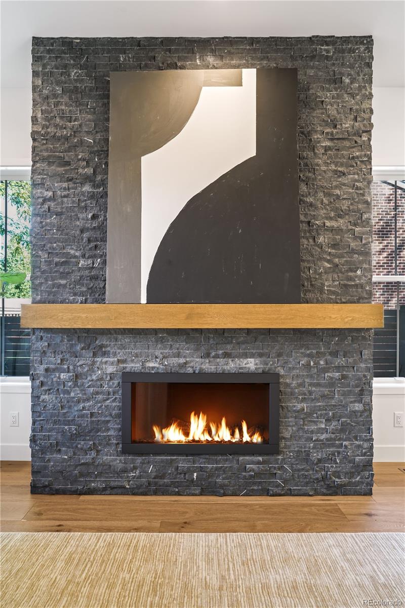 1067 South Cook Street Denver, CO 80209 - Photo 9 of 35 a stone fireplace