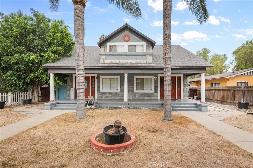 3974 5th Street Riverside, CA 92501 - Photo 3 of 45 a front view of a house with garden space and barbeque oven