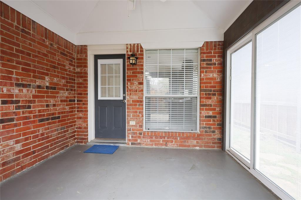8112 Dock Street Frisco, TX 75035 - Photo 29 of 34 a view of an empty room with a fireplace and a window