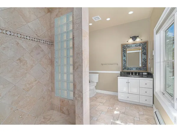 a bathroom with a sink a mirror and a shower