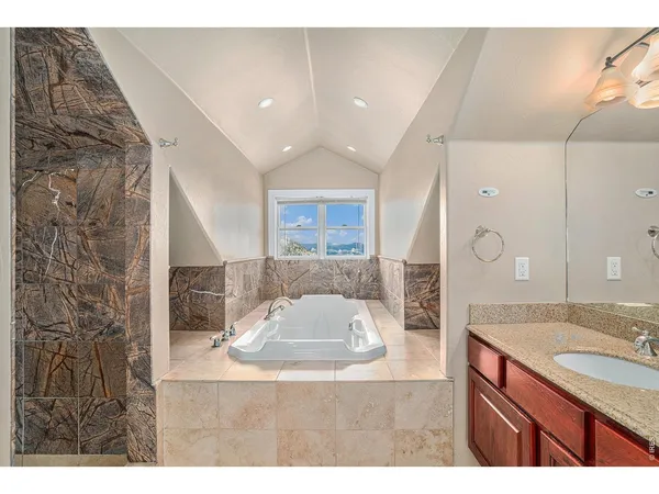a bathroom with a sink double vanity and a mirror