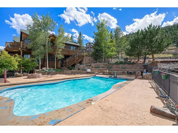 a view of a backyard with sitting area