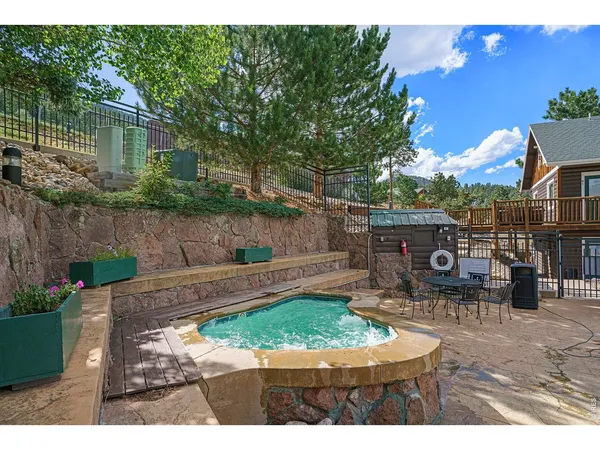 a view of a swimming pool with a yard