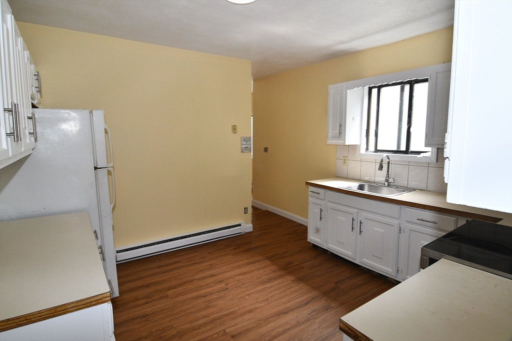 112 Johnson Street Lynn, MA 01902 - Photo 12 of 28 a spacious bathroom with a double vanity sink and a mirror