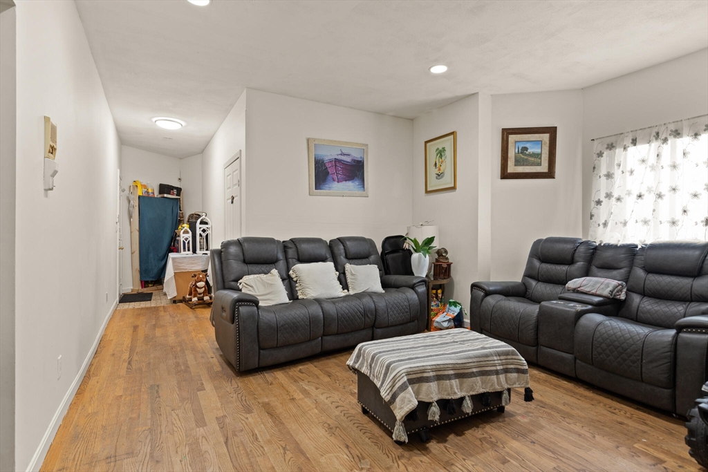 112 Johnson Street Lynn, MA 01902 - Photo 19 of 28 a living room with furniture and a wooden floor