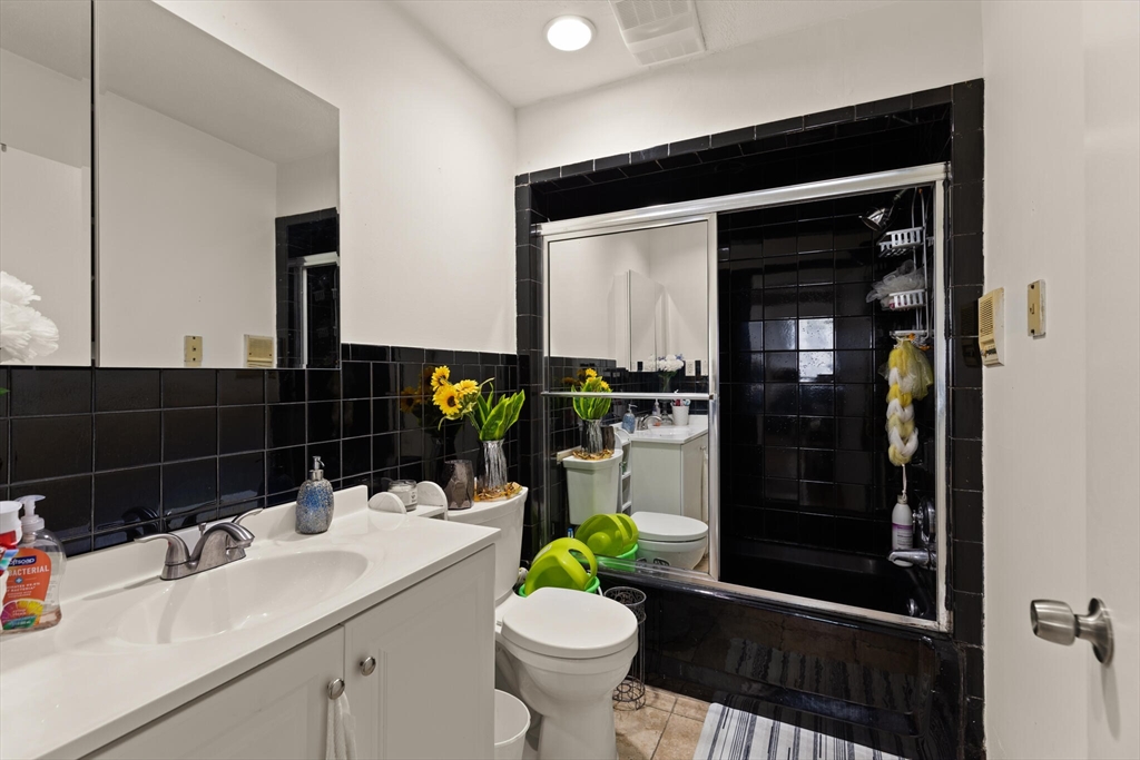 112 Johnson Street Lynn, MA 01902 - Photo 20 of 28 a bathroom with a sink toilet and shower