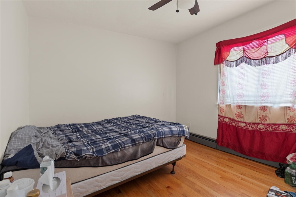 112 Johnson Street Lynn, MA 01902 - Photo 28 of 28 a bedroom with a bed and a window
