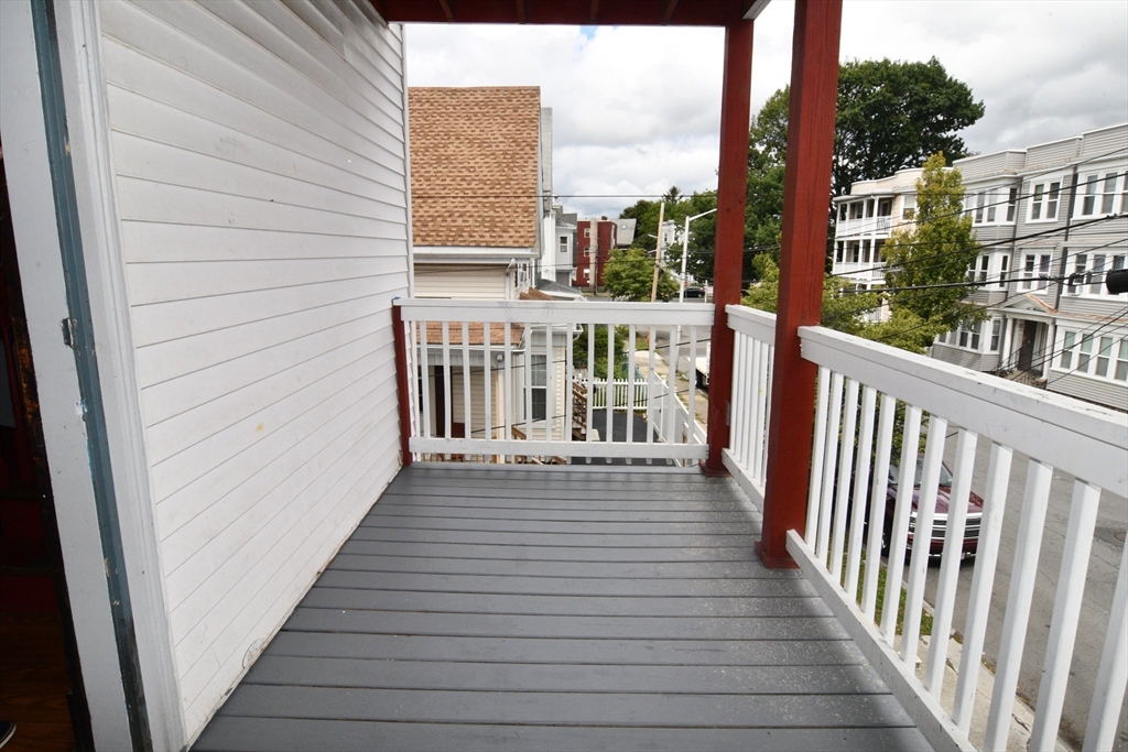 112 Johnson Street Lynn, MA 01902 - Photo 5 of 28 a view of a balcony with wooden floor