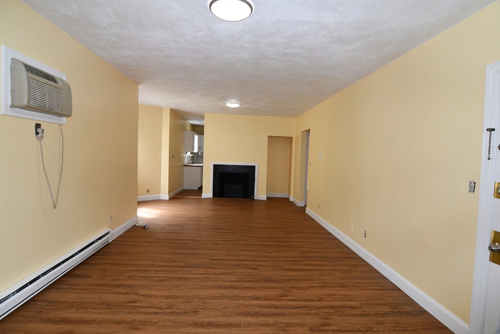 112 Johnson Street Lynn, MA 01902 - Photo 6 of 28 a view of empty room with wooden floor