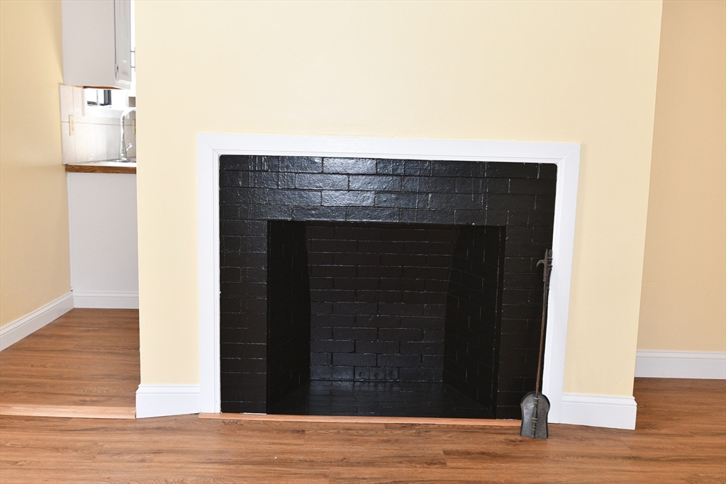 112 Johnson Street Lynn, MA 01902 - Photo 8 of 28 a view of empty room with wooden floor