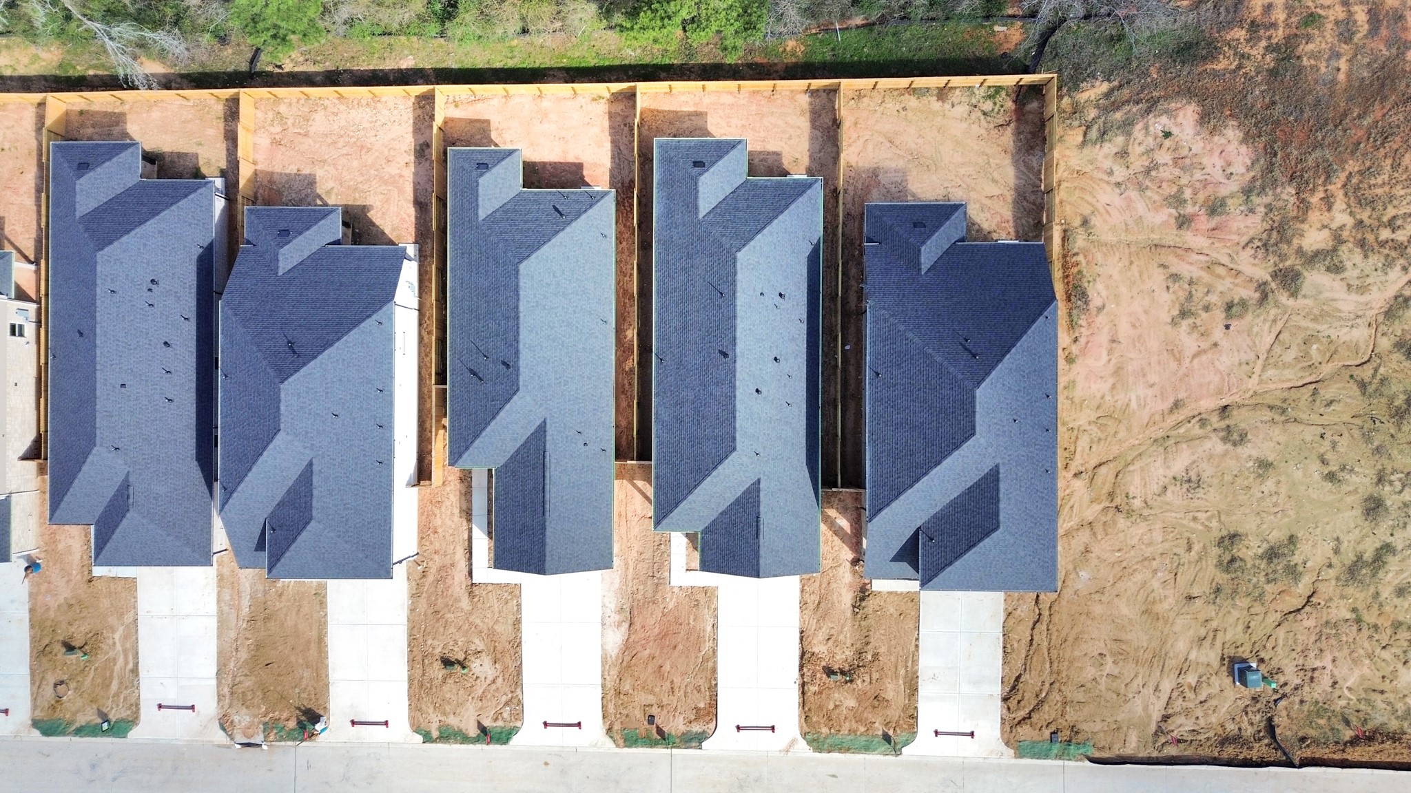 19555 Montgomery Rdg Way Montgomery, TX 77316 - Photo 6 of 21 An aerial view of a spacious subdivision lot, highlighting a well-maintained yard and a fully fenced perimeter, offering both privacy and expansive outdoor space. Landscape pending.