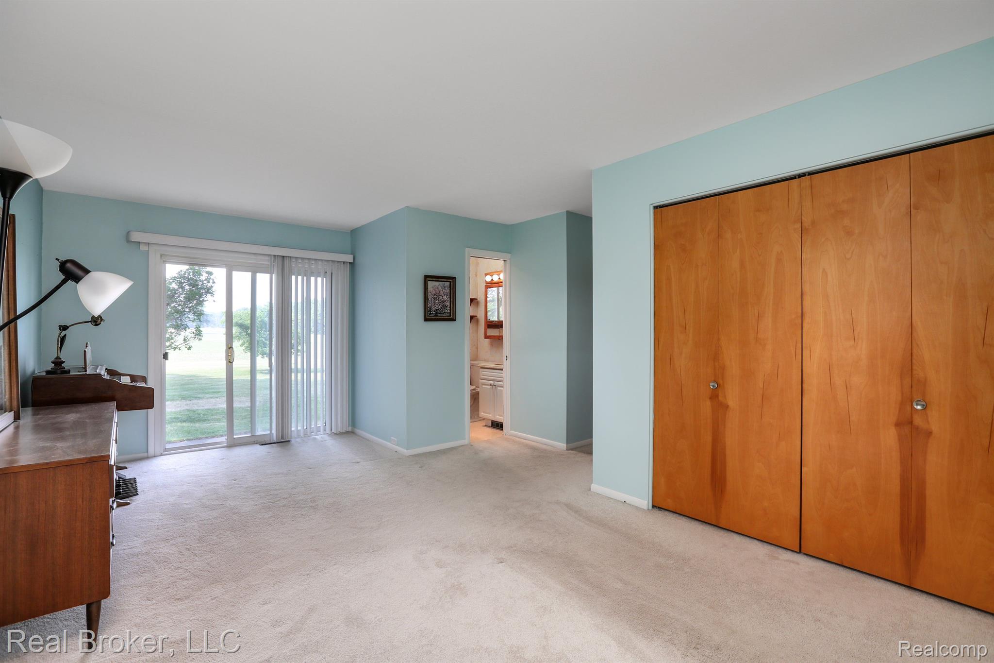 10037 Lahring Road Gaines, MI 48436 - Photo 20 of 38 Primary bedroom suite with slider out to a patio