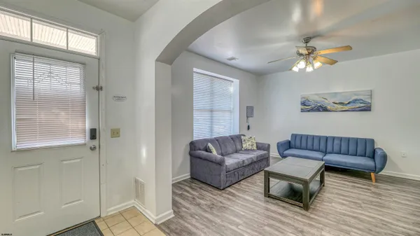 a living room with furniture and a window