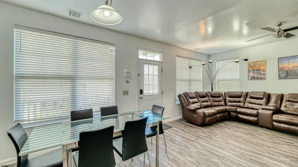 a view of a livingroom with furniture and window