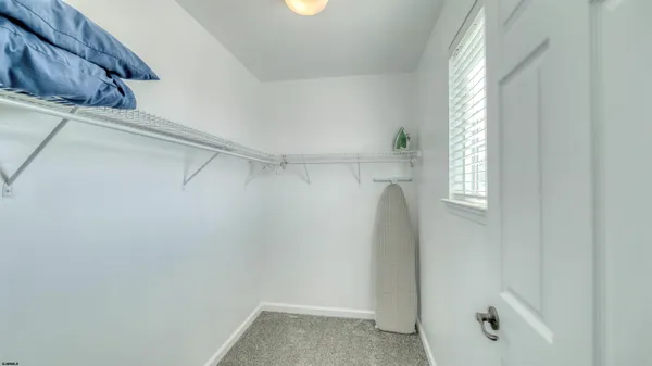 a view of walk in closet with window