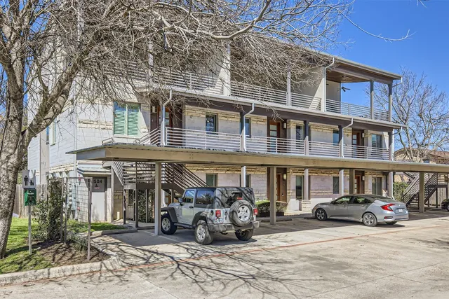 a view of a car park in front of a building