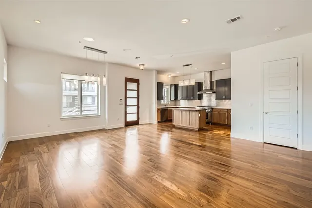a view of kitchen with cabinets and wooden floor