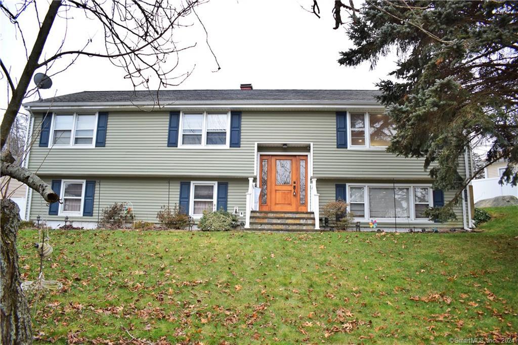 165 Valley View Road Stratford, CT 06614 - Photo 1 of 1 a front view of a house with a yard