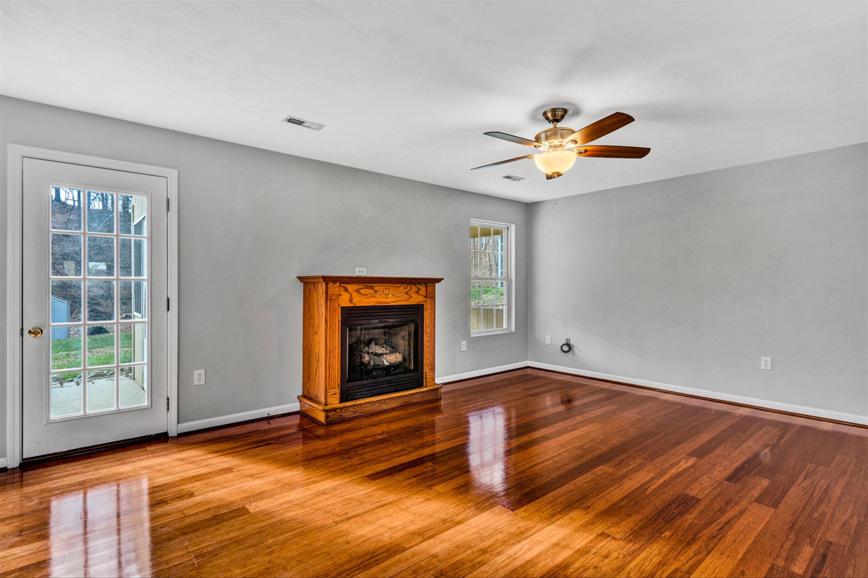 4218 Daugherty Road Salem, VA 24153 - Photo 9 of 35 wooden floor in an empty room with a window