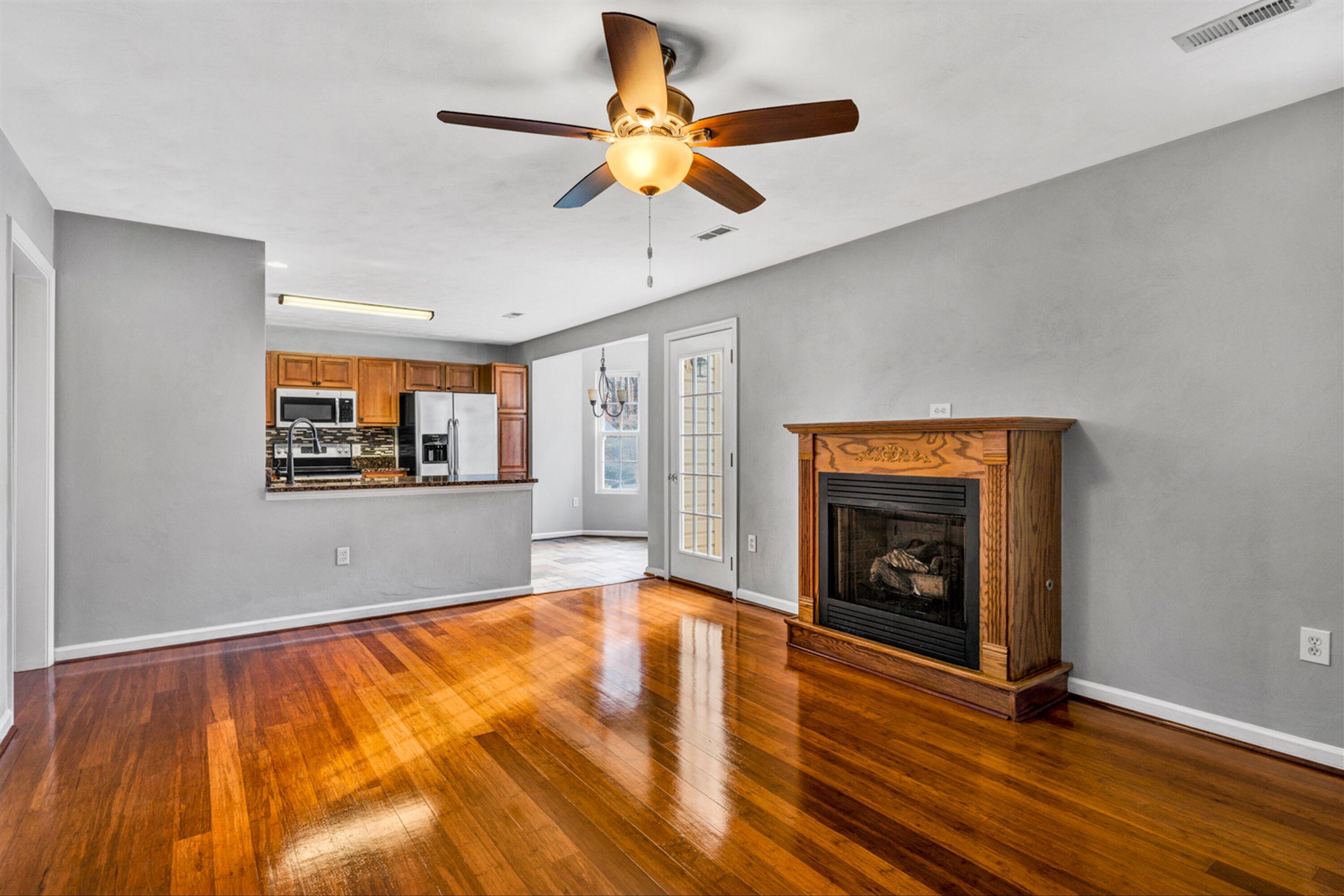 4218 Daugherty Road Salem, VA 24153 - Photo 10 of 35 a view of empty room with wooden floor and a fireplace