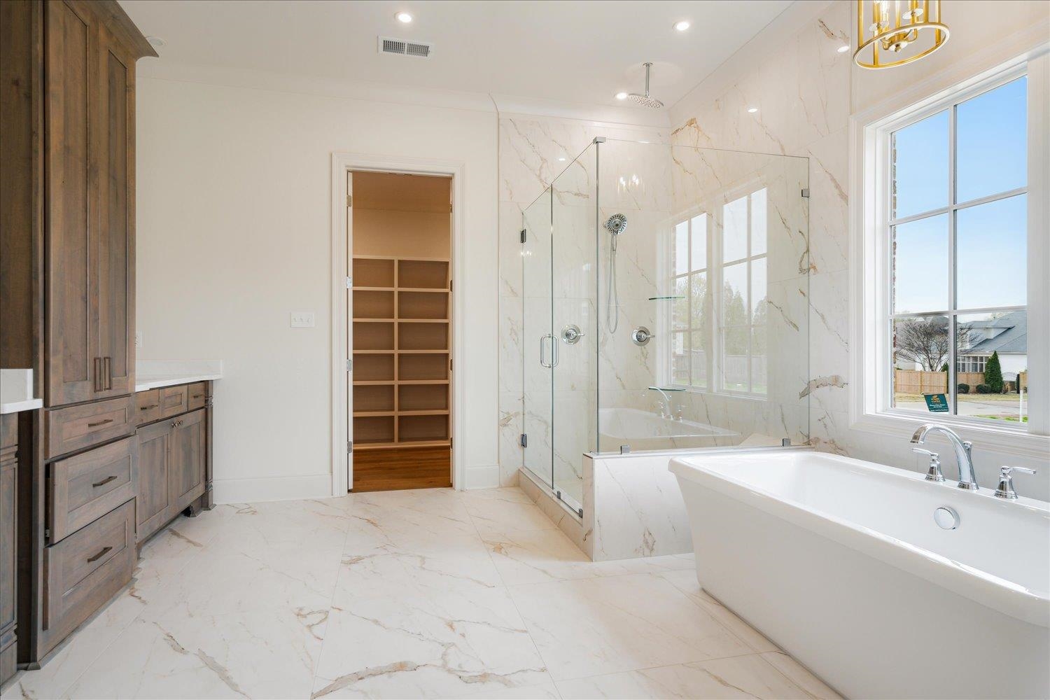 12600 Miss Cloud Road Collierville, TN 38017 - Photo 22 of 40 Bathroom featuring a marble finish shower, recessed lighting, a soaking tub, marble finish floor, and visible vents