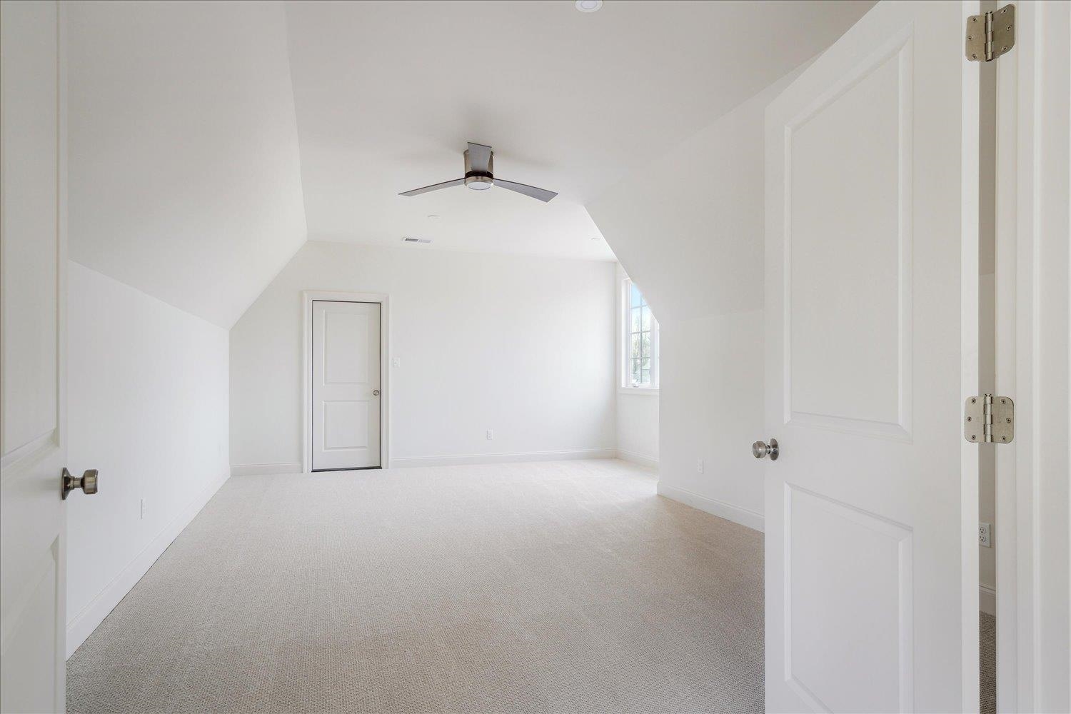 12600 Miss Cloud Road Collierville, TN 38017 - Photo 27 of 40 Bonus room featuring baseboards, vaulted ceiling, carpet, and a ceiling fan