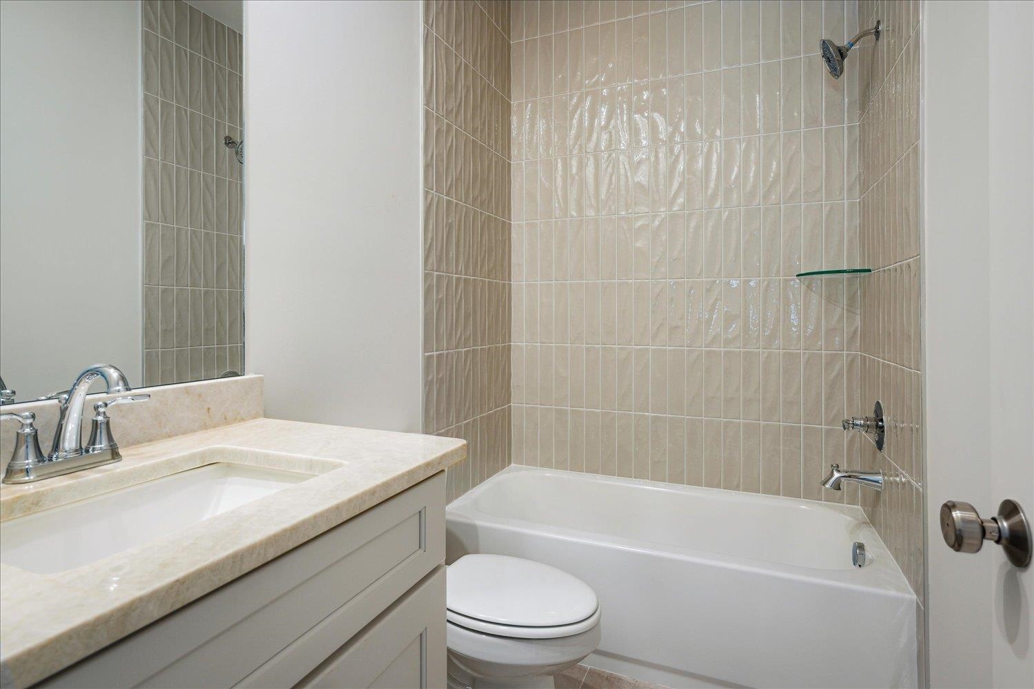 12600 Miss Cloud Road Collierville, TN 38017 - Photo 30 of 40 Bathroom featuring tub / shower combination, toilet, and vanity