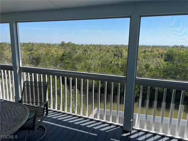 a view of a balcony with chair