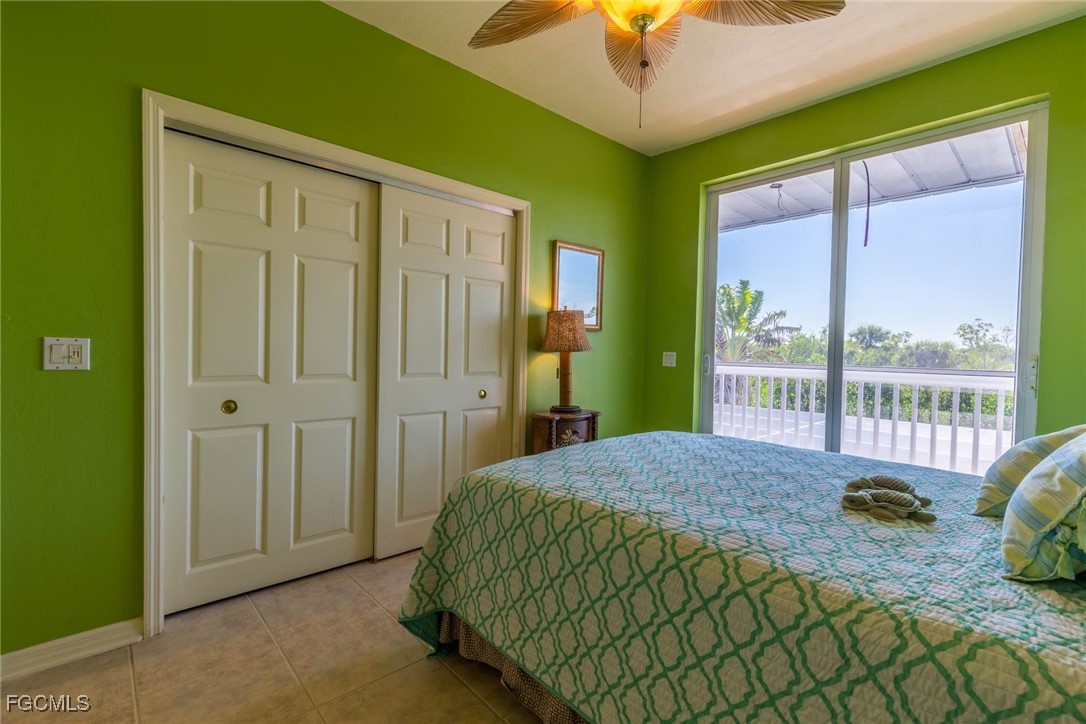 621 Rum Road Captiva, FL 33924 - Photo 18 of 50 a bedroom with a bed and a window