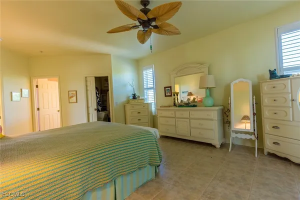 a bedroom with a bed and a cabinets