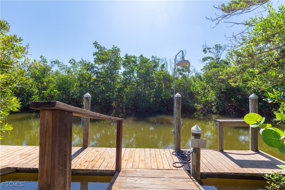 621 Rum Road Captiva, FL 33924 - Photo 37 of 50 a view of a wooden deck and a lake view