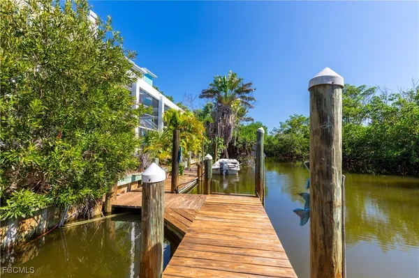 a lake view with a wooden bridge