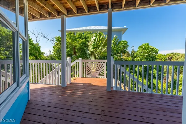 a balcony with wooden floor