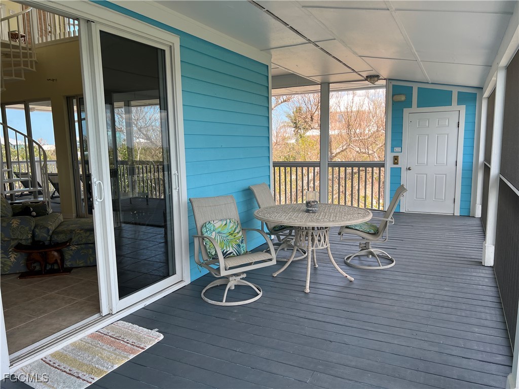 621 Rum Road Captiva, FL 33924 - Photo 47 of 50 a view of a dining room with furniture and wooden floor