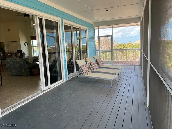 a view of balcony with wooden floor