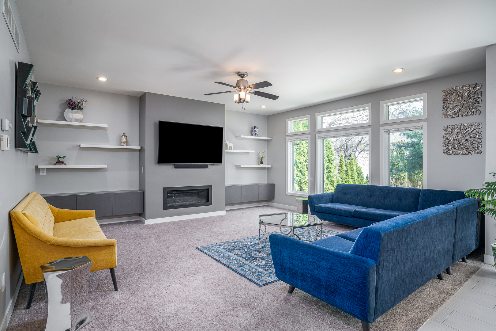 3404 77th St Court Moline, IL 61265 - Photo 12 of 37 a living room with furniture a fireplace and a flat screen tv