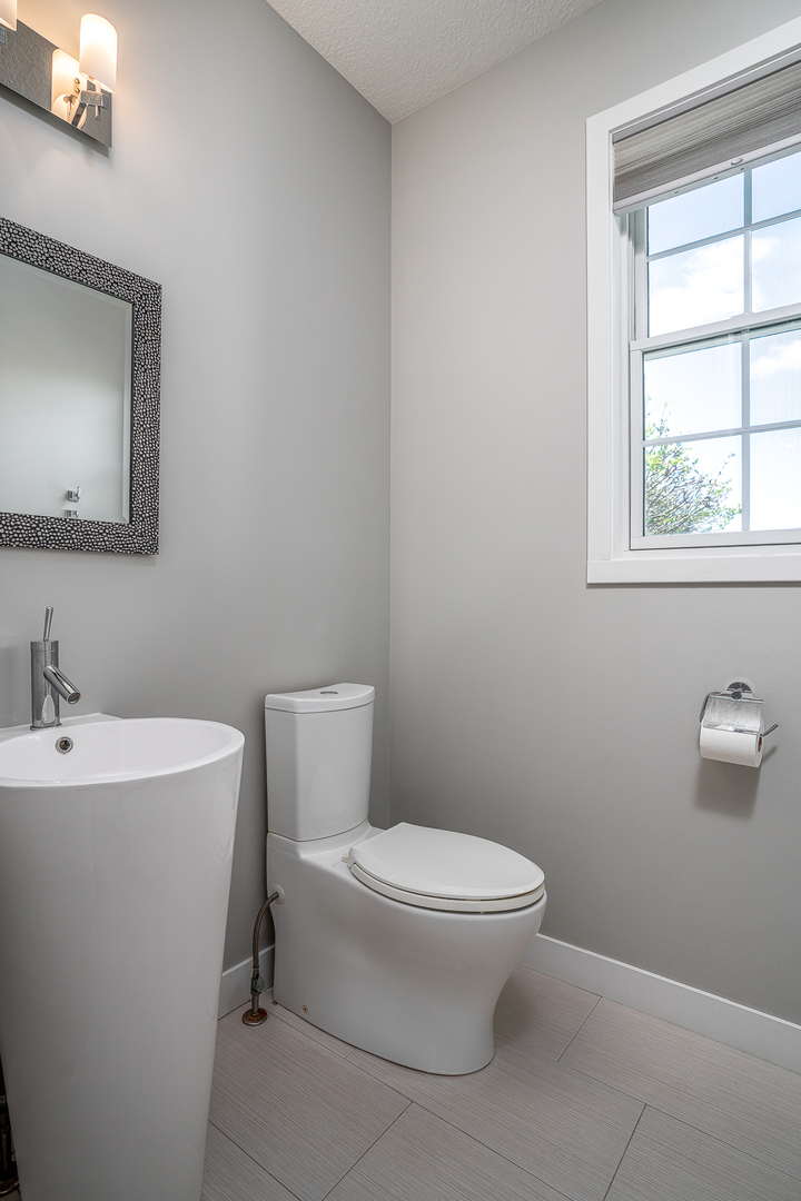 3404 77th St Court Moline, IL 61265 - Photo 13 of 37 a white toilet sitting next to a bathroom sink