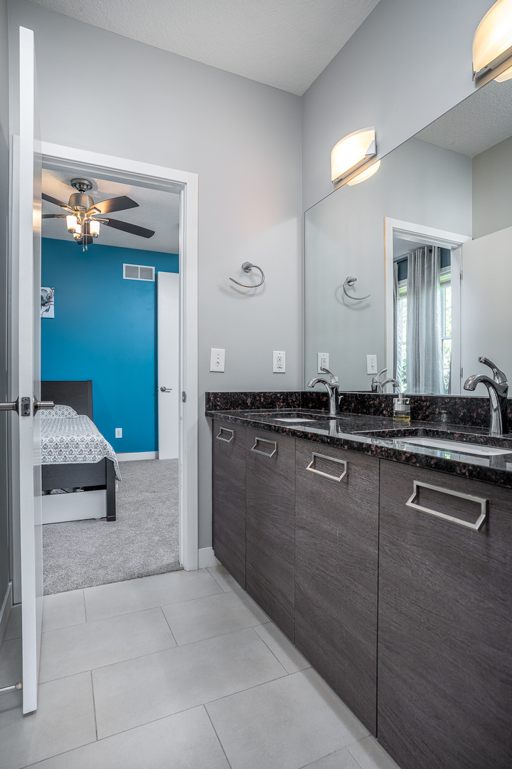 3404 77th St Court Moline, IL 61265 - Photo 16 of 37 a bathroom with a sink and a mirror
