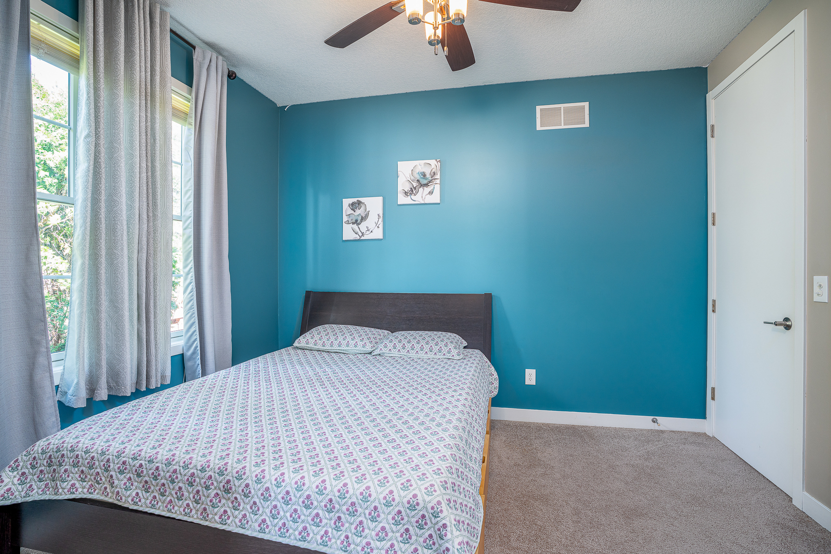 3404 77th St Court Moline, IL 61265 - Photo 17 of 37 a bedroom with a bed and a chandelier