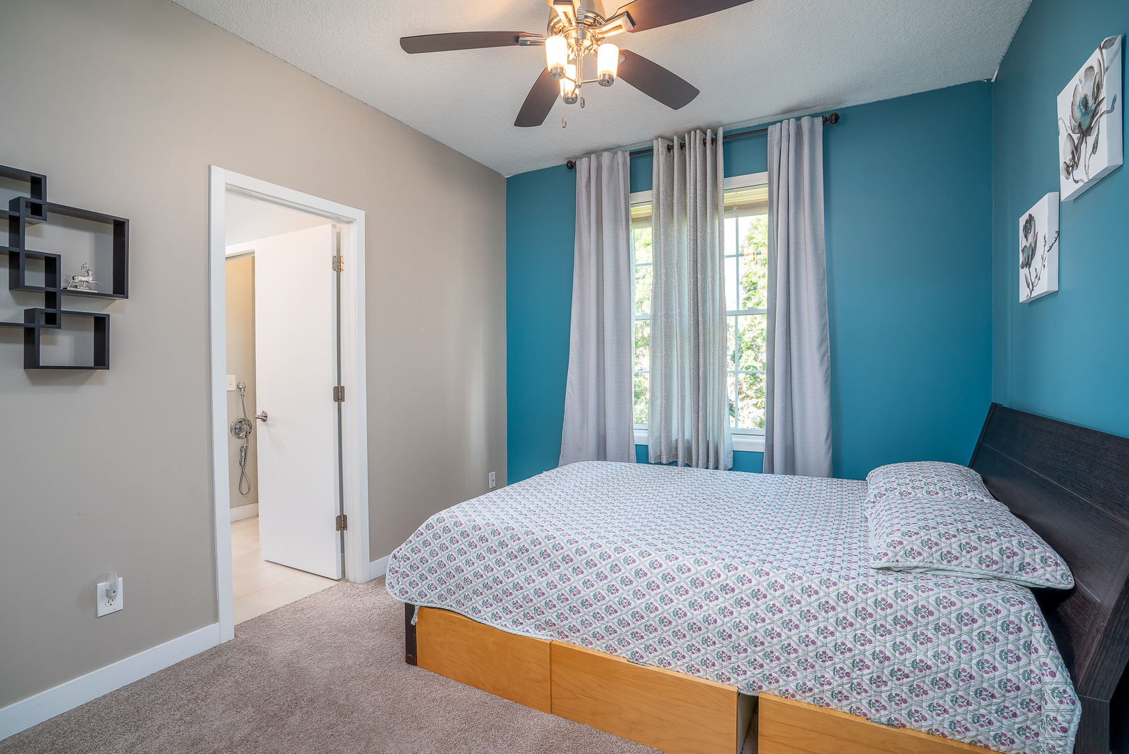 3404 77th St Court Moline, IL 61265 - Photo 18 of 37 a bedroom with a large bed and a chandelier